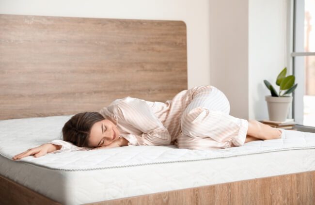A woman enjoying a cleaning mattress